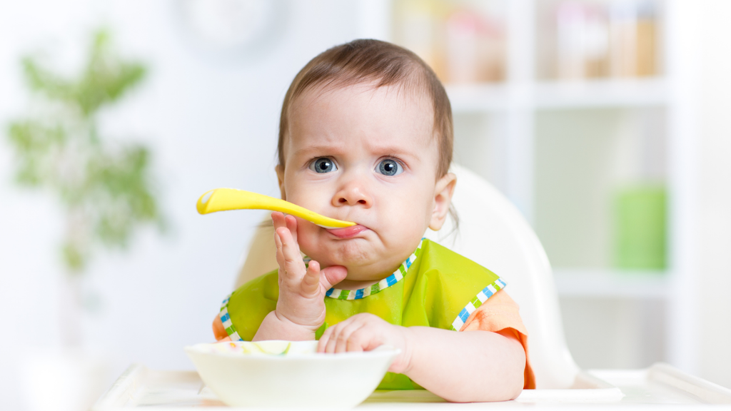 baby is eating first food