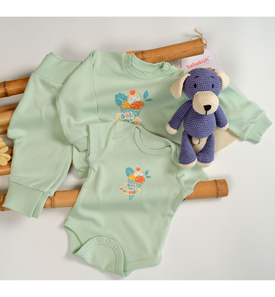 organic baby clothing and a toy