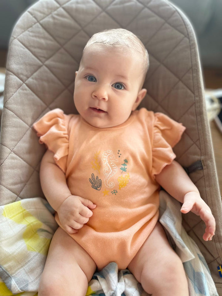 short sleeve bodysuit with a baby